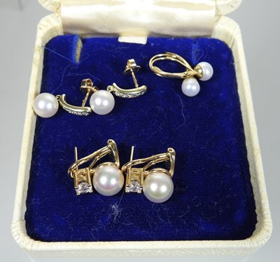 Lot 26 - A pair of 14 carat gold diamond and cultured pearl earrings