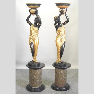 Lot 426 - After Milo, Miguel Fernando Lopez, Portuguese, contemporary, a pair of bronze and gilt figures