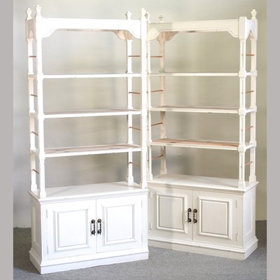 Lot 488 - A pair of white painted open bookcases