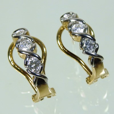 Lot 43 - A pair of 14 carat gold and diamond pendant earrings