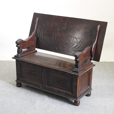 Lot 476 - An early 20th century carved oak monk's bench
