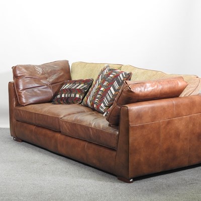 Lot 530 - A modern brown leather upholstered sofa