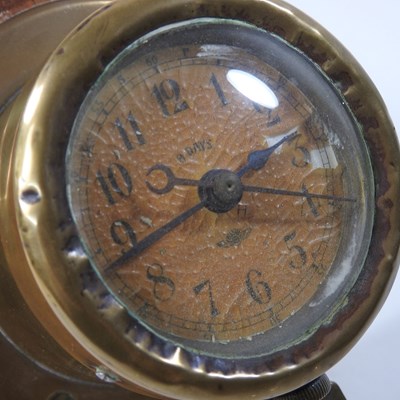 Lot 46 - An early 20th century brass dashboard clock