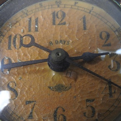 Lot 46 - An early 20th century brass dashboard clock