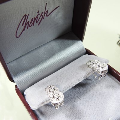 Lot 61 - A pair of 14 carat gold diamond pendant earrings