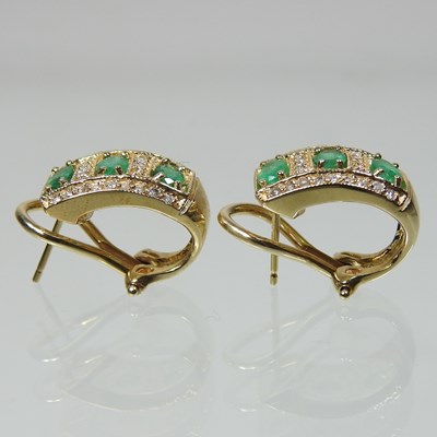 Lot 56 - A pair of 14 carat gold emerald and diamond earrings