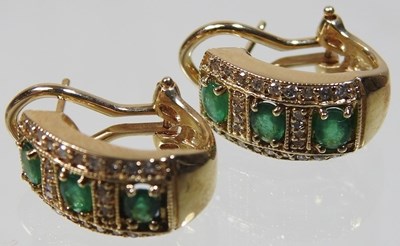 Lot 56 - A pair of 14 carat gold emerald and diamond earrings