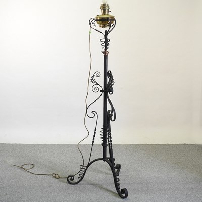 Lot 474 - An Arts and Crafts style wrought iron telescopic lamp stand