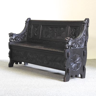 Lot 488 - A 19th century carved dark oak settle