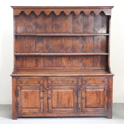 Lot 485 - A George III style oak dresser
