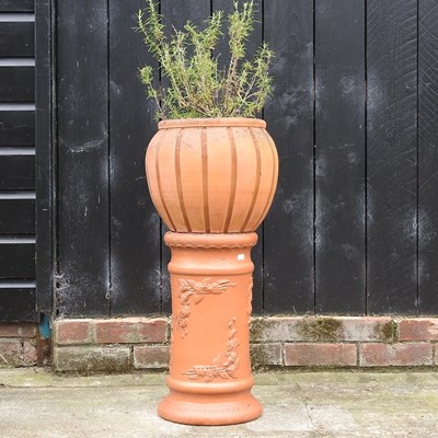 Lot 318 - A terracotta planter on column