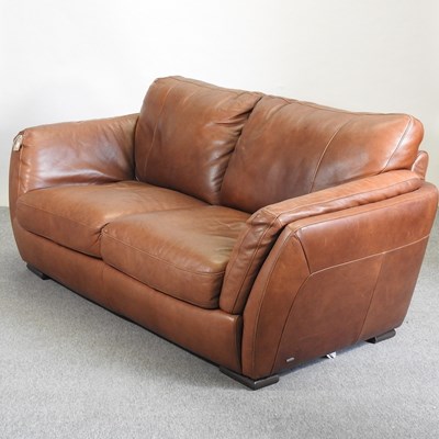 Lot 636 - A leather upholstered sofa