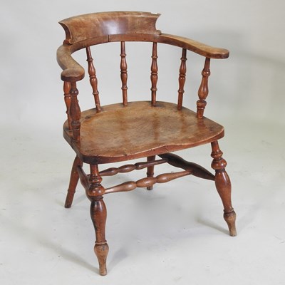 Lot 97 - An early 20th century elm seated smokers bow chair