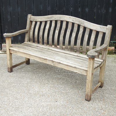 Lot 335 - A hardwood slatted garden bench