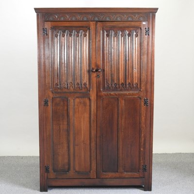Lot 564 - A 1920's oak wardrobe