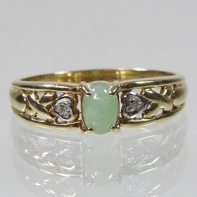 Lot 23 - A 9 carat gold diamond and jade ring