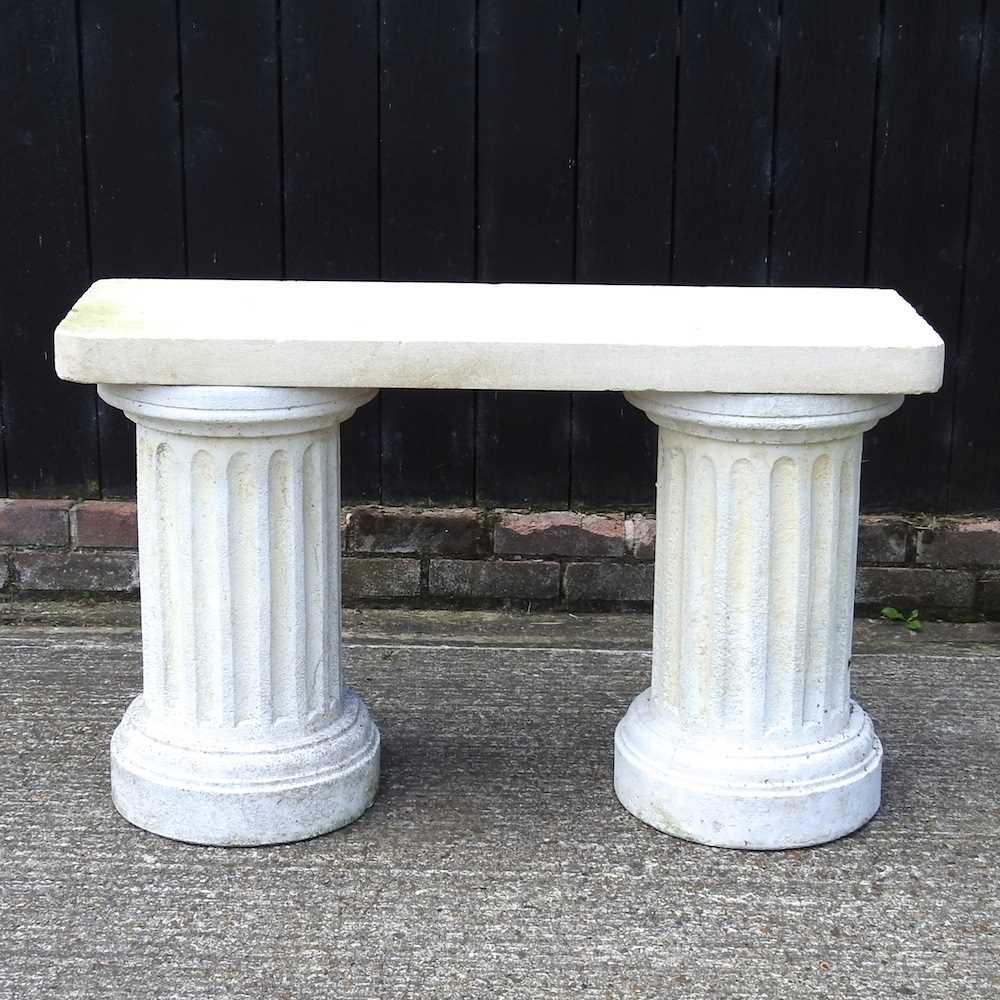 Lot 346 - A cast stone garden bench