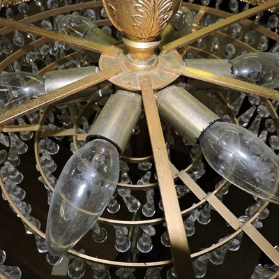 Lot 34 - A gold painted metal and cut glass chandelier