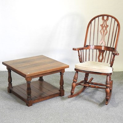 Lot 583 - An Ercol style elm rocking chair