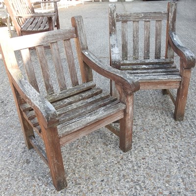 Lot 347 - A pair of wooden garden armchairs