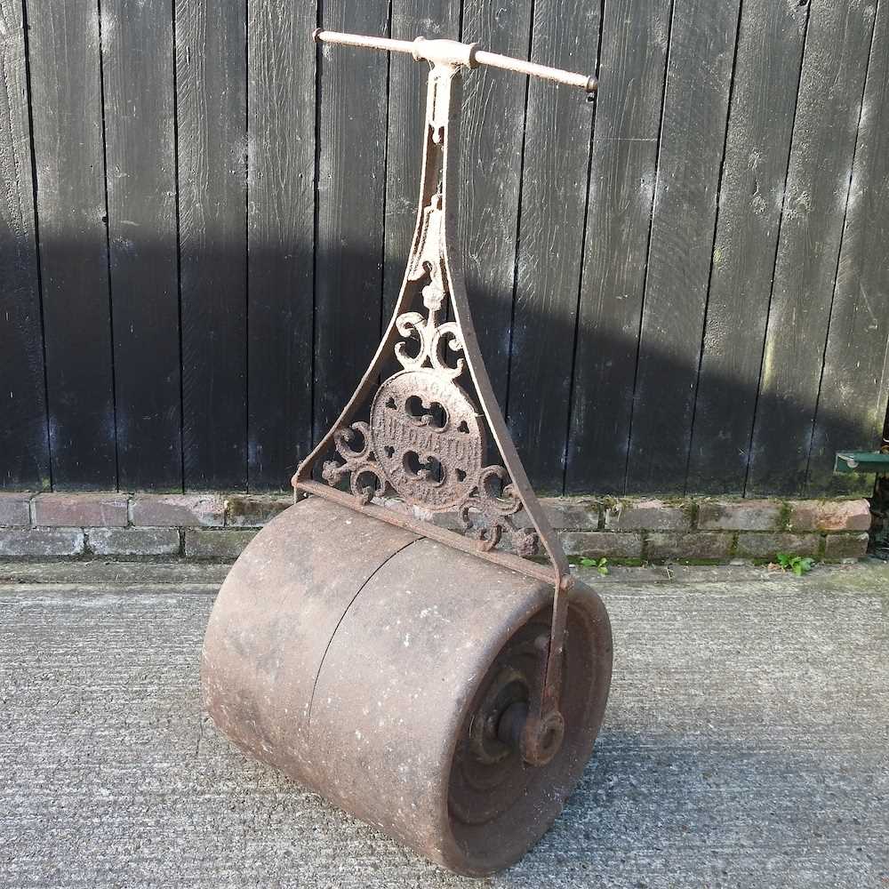 Lot 348 - An antique Ransomes iron garden roller