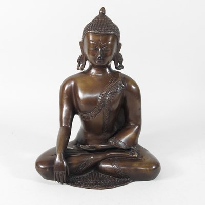 Lot 192 - A reproduction bronze figure of a buddha