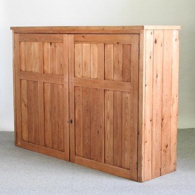 Lot 420 - A pine school cupboard