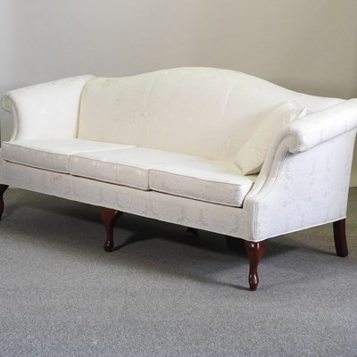 Lot 490 - A George III style white upholstered hump back sofa