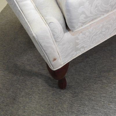 Lot 490 - A George III style white upholstered hump back sofa