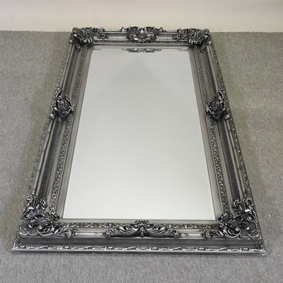 Lot 361 - A large and  ornate silver painted wall mirror