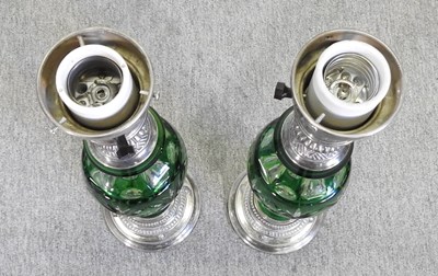 Lot 458 - A pair of metal and green cut glass table lamps
