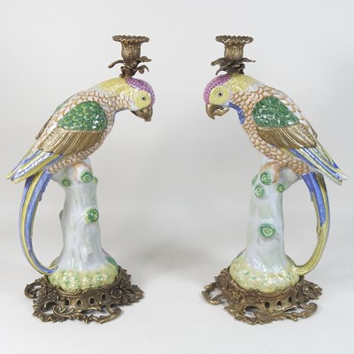 Lot 157 - A pair of porcelain candlesticks
