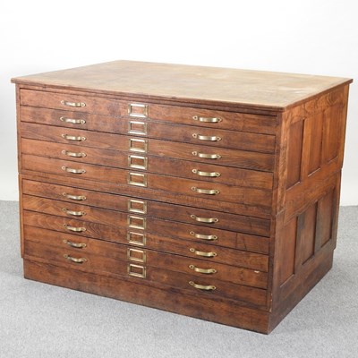 Lot 431 - An early 20th century oak plan chest
