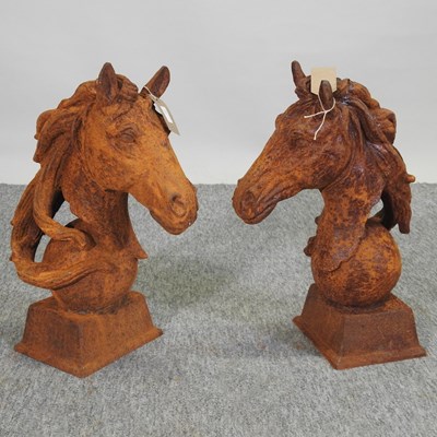 Lot 104 - A pair of rusted horse head finials, 45cm high