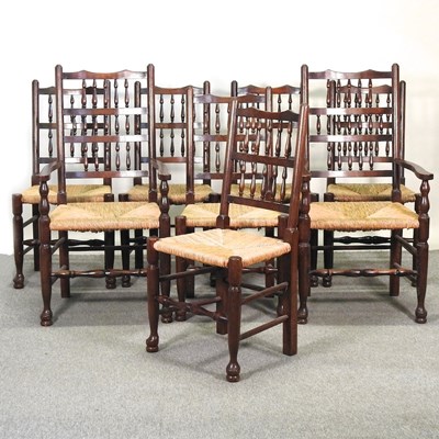 Lot 504 - A set of eight rush seated spindle back dining chairs