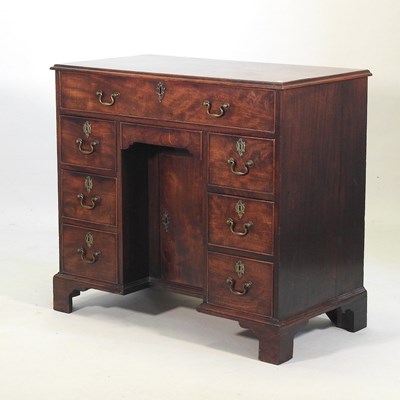 Lot 700 - A George III mahogany kneehole desk