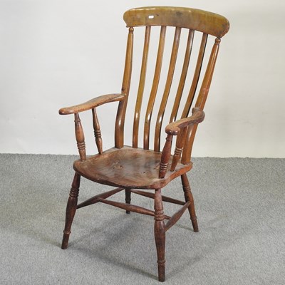 Lot 510 - A 19th century Windsor style armchair