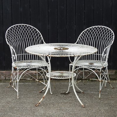 Lot 311 - A cream painted wirework garden table