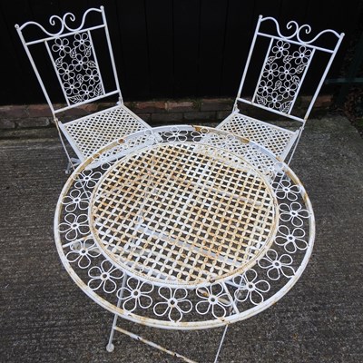 Lot 311 - A cream painted wirework garden table