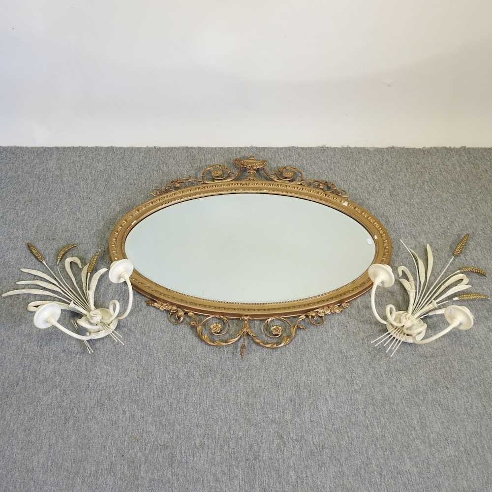 Lot 184 - A gilt framed oval wall mirror