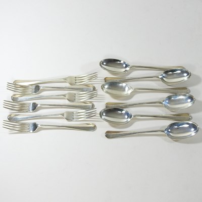 Lot 54 - A set of six George V fiddle pattern silver dessert forks and spoons