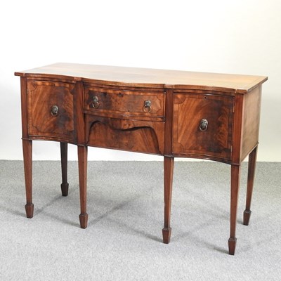 Lot 534 - A Regency style mahogany serpentine sideboard