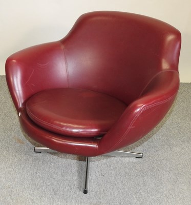 Lot 664 - A  1970's Danish red leather upholstered revolving armchair