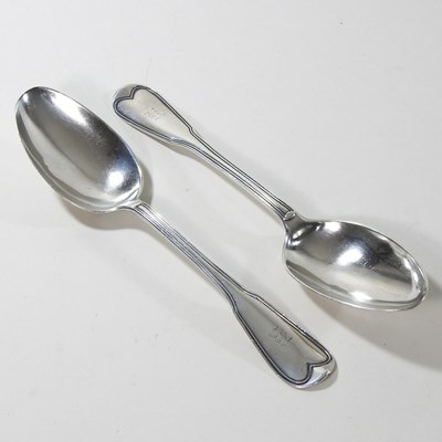 Lot 62 - A pair of George III silver serving spoons