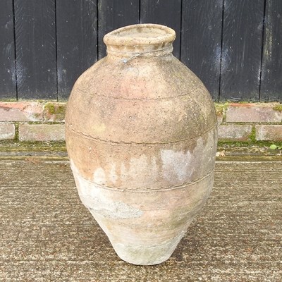 Lot 324 - A terracotta olive jar