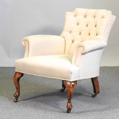 Lot 564 - A 1920's cream upholstered button back armchair