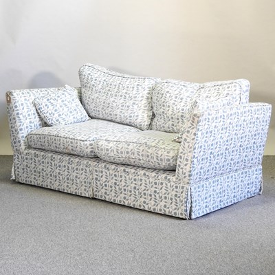 Lot 557 - A modern blue and white upholstered sofa