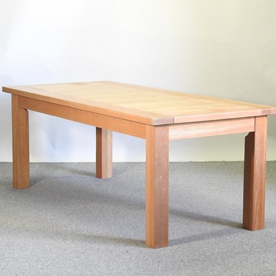 Lot 387 - A modern light oak dining table