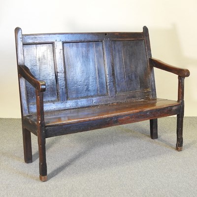 Lot 581 - An 18th century and later oak settle