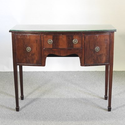 Lot 587 - A Regency style mahogany bow front sideboard